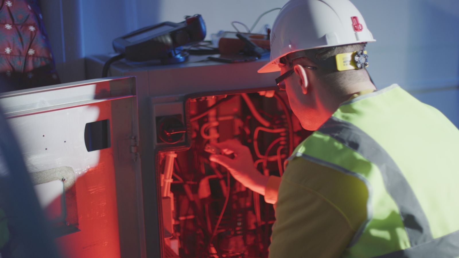 emergency electrician looking at electrical box