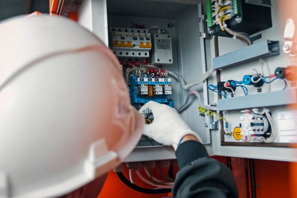 emergency electrician fixing powerboard